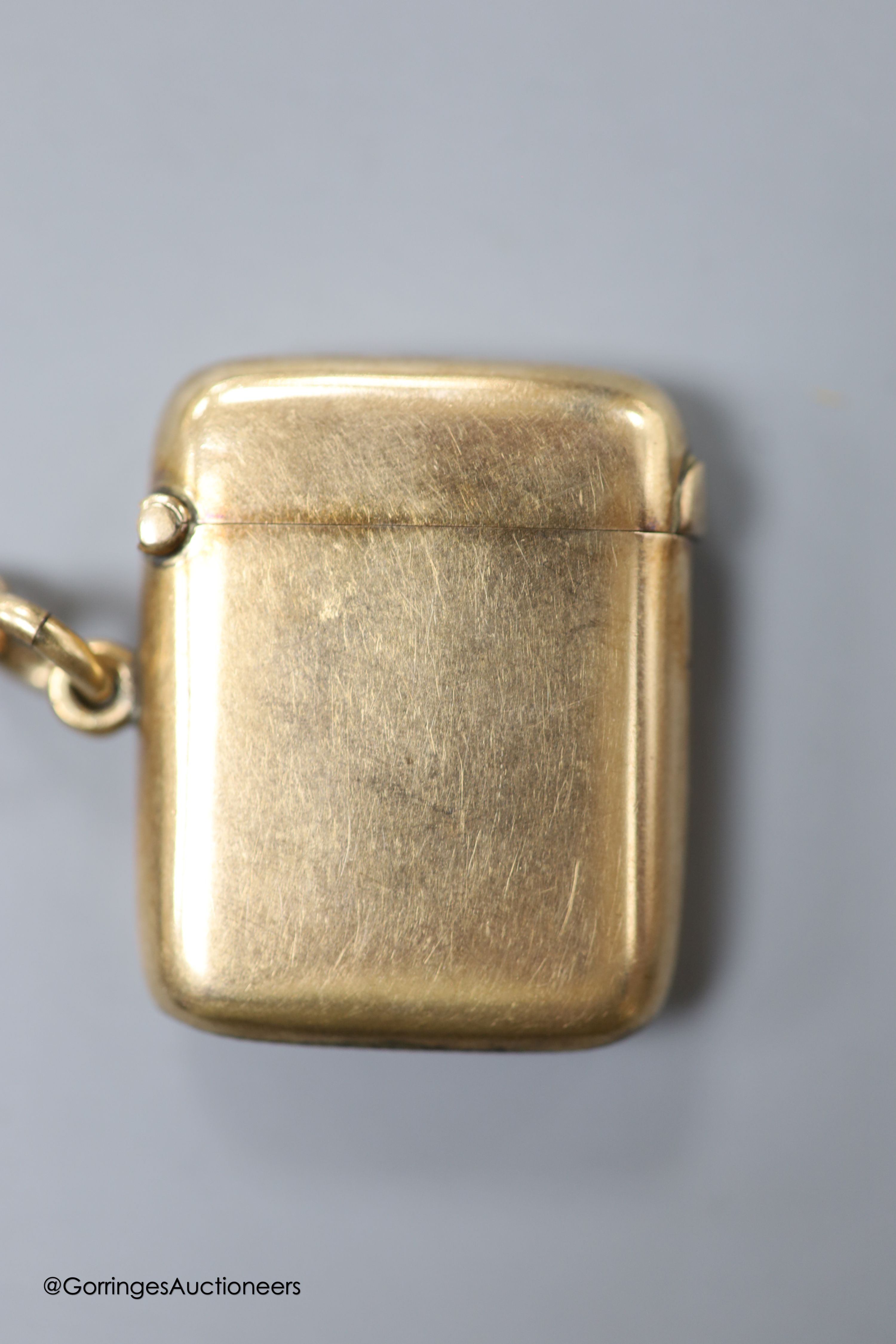 A late Victorian 9ct gold vesta case, William Neale, Chester, 1899, 40mm, with two hair mounted fobs